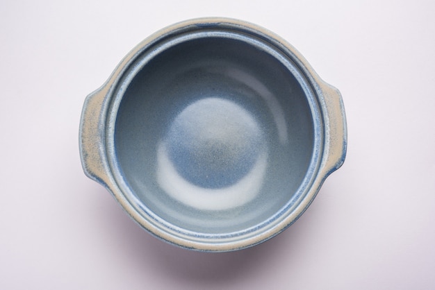 Blue empty ceramic bowl or container with lid, isolated over plain surface