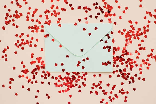 Blue envelope and red heart confetti