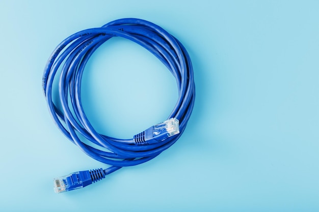 Blue ethernet cable cord patch cord on a blue