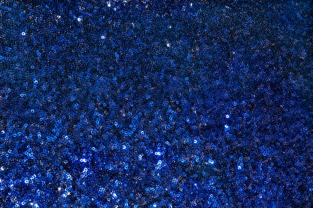 Blue fabric texture with sequins and metallic shiny Dark blue fish scale sequin fabric