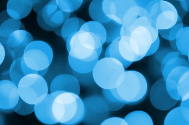 Blue Festive Christmas elegant abstract background with many bokeh lights.