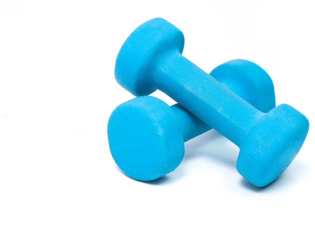 Blue fitness dumbbells on a white background. the concept of a healthy lifestyle. fitness attributes