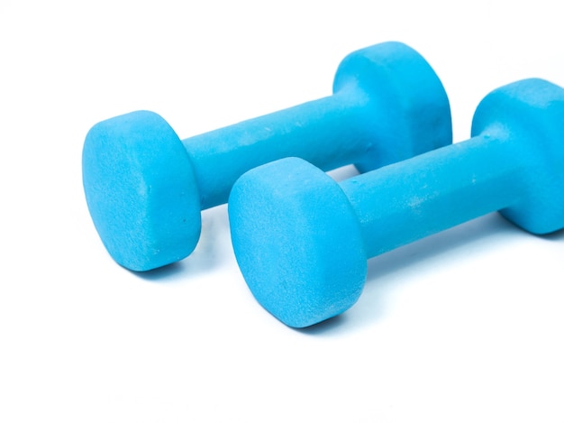 Blue fitness dumbbells on a white background. the concept of a healthy lifestyle. fitness attributes