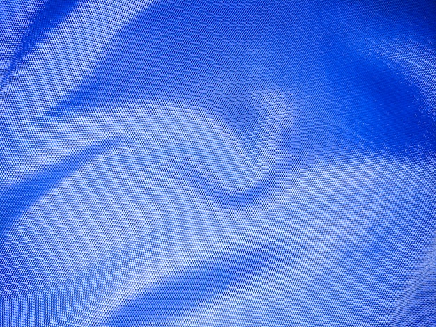 Blue full frame wrinkled polyester fabric texture background