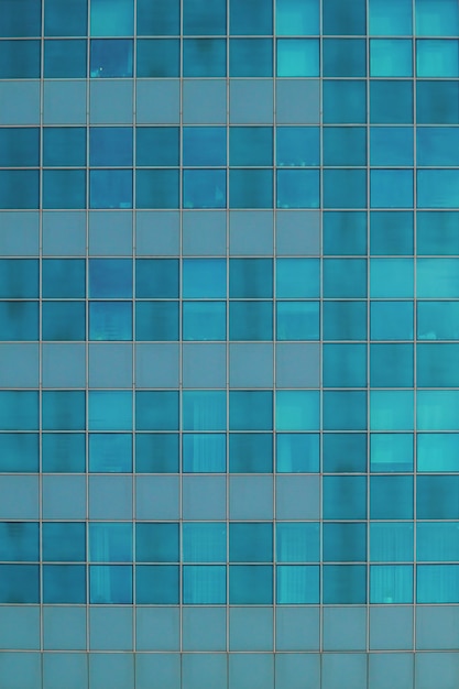 Blue glass wall of skyscraper