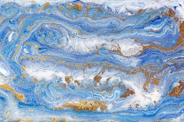 Blue and gold marbling. Golden marble liquid texture.