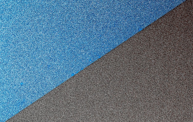 A blue and gray surface with a white edge.