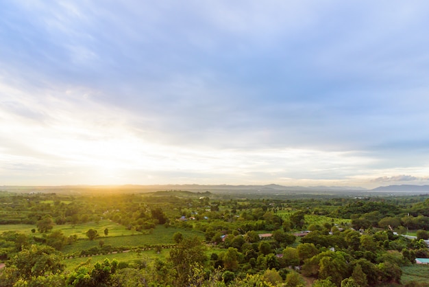 Blue and green Landscape of cloudy, mountain and forest with sunset in the evening from top view.