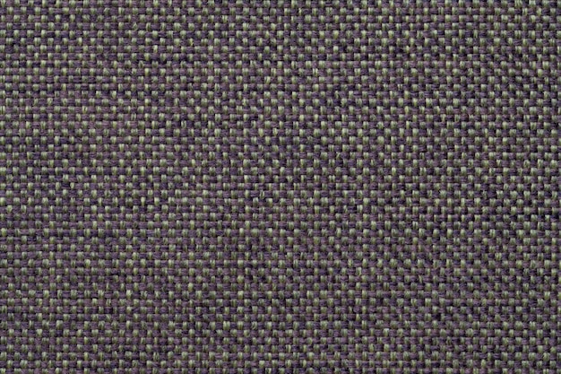 Blue and green textile background with checkered design, closeup. Structure of the fabric macro.