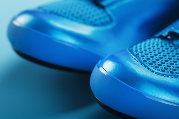 Blue highway cycling shoes on a blue background