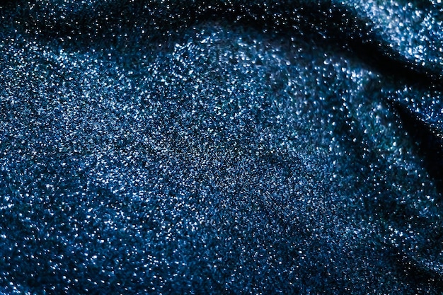 Blue holiday sparkling glitter abstract background luxury shiny fabric material for glamour design and festive invitation