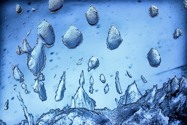 blue ice glass background, abstract texture of the surface of the ice on the glass, frozen seasonal water