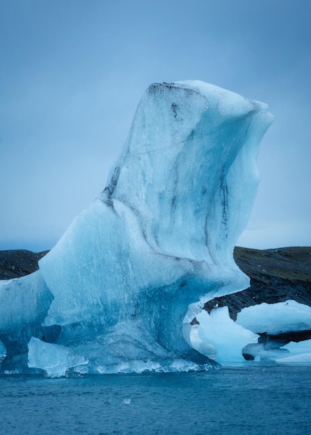 Blue iceberg floating on glacier lagoon from Breidamerkurjokull glacier in Jokulsarlon Iceland