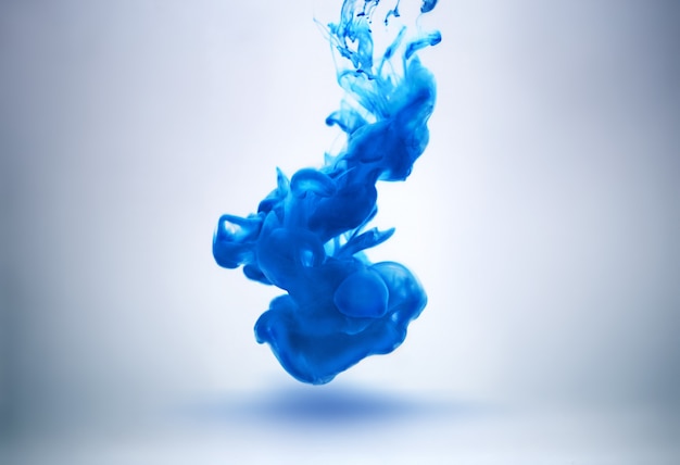 Blue ink underwater as abstract background for your project