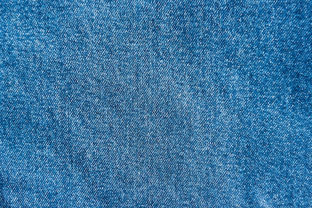 Photo blue jeans fabric texture for background and pattern