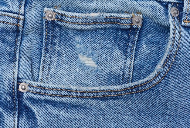 Blue jeans front pocket with buttons