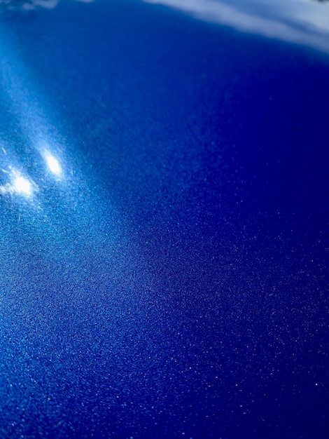 Blue lacquer coating with reflection of the sun