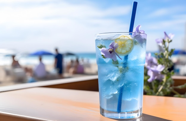 Blue lagoon cocktail with ice and flowers on a wooden table