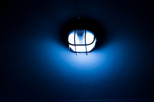 Blue lamp mounted on the wall