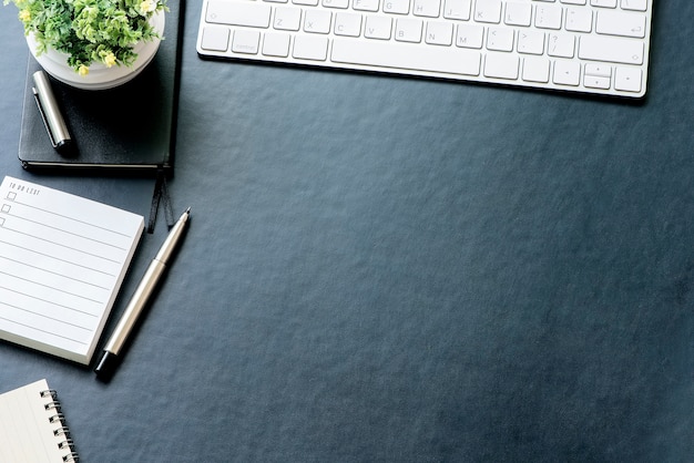 Blue leather office desk with office supplies and copy space.