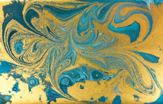 Blue marbling background. Golden marble liquid texture.