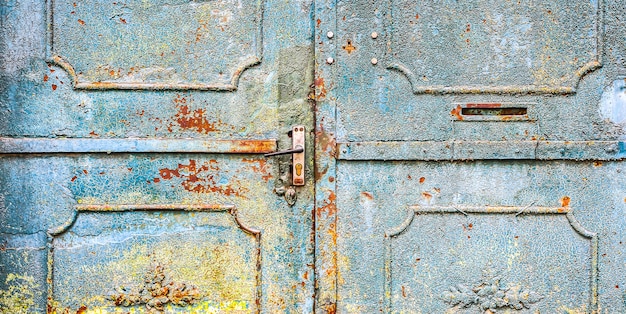 Blue metal doors. Old vintage style. Rusty texture.