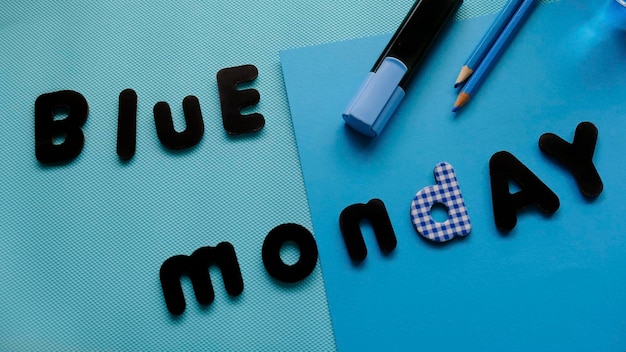 Blue Monday lettering on blue background with blue stationery.