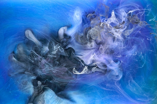 Blue multicolored smoke abstract background acrylic paint underwater explosion