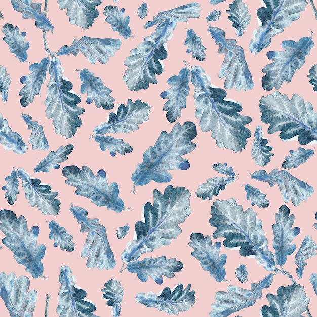 Blue oak leaves on a pink background. Seamless pattern