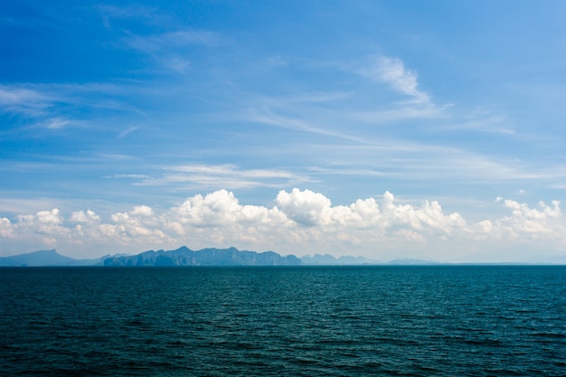 Blue ocean with cloudy sky