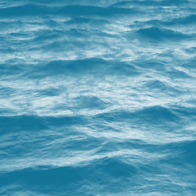 A blue ocean with waves and the words ocean on it