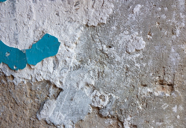 Blue old chipped  paint on a concrete wall