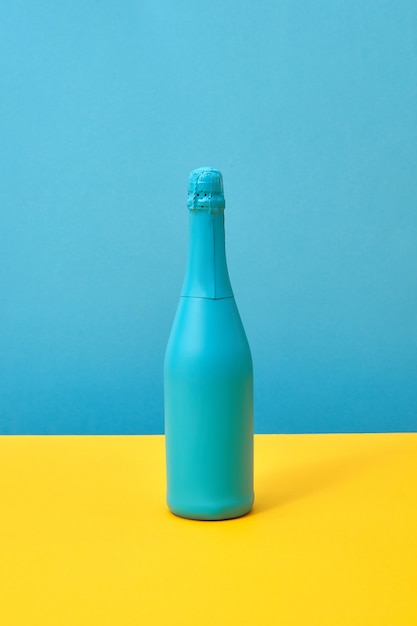 Blue painted holiday mockup bottle on a duotone background