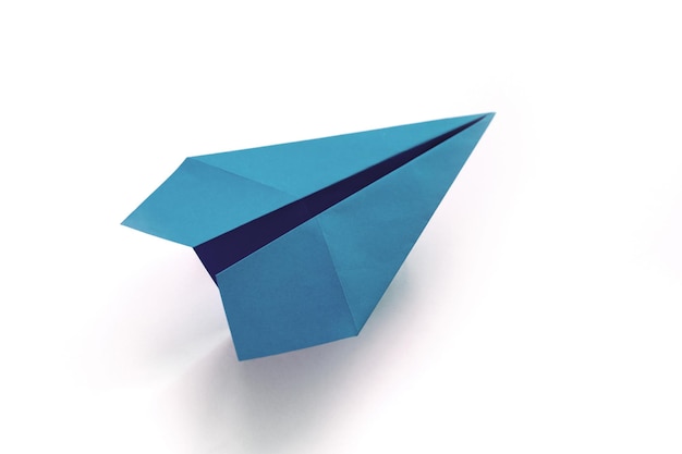 Blue paper plane origami isolated on a white background