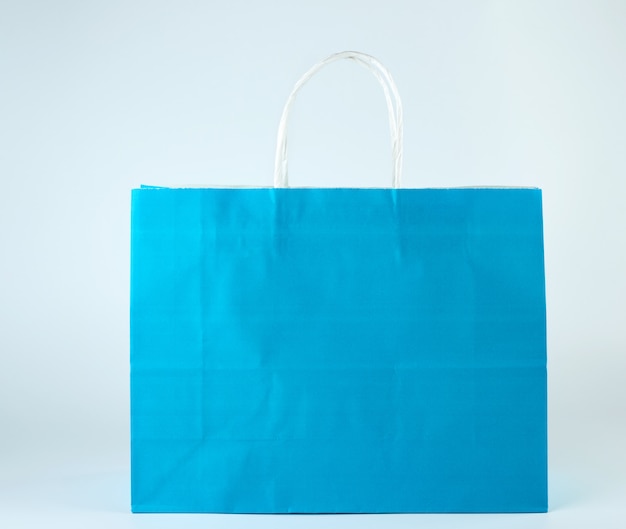 Blue paper shopping bag with a handle 