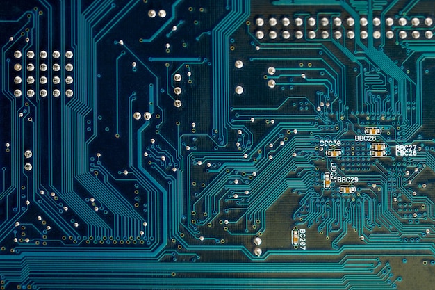 Blue pcb board circuit close up technology background