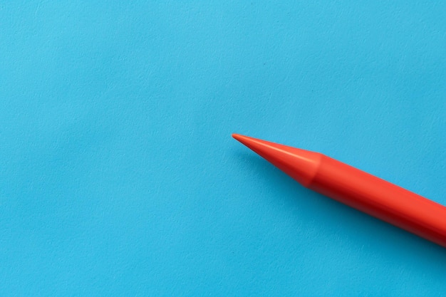 a blue piece of paper with a red triangle on it