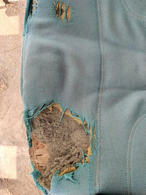 a blue pillow with a hole in the middle that has a hole in it