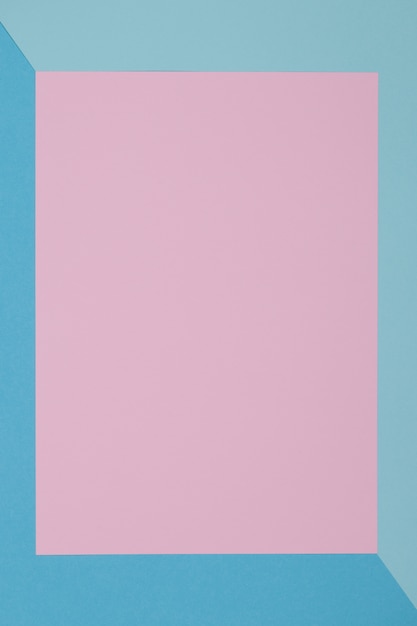 Blue and pink background, colored paper geometrically divides into zones, frame, copy, space.