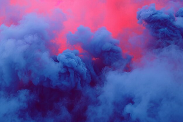 Blue and pink clouds of smoke on a dark background