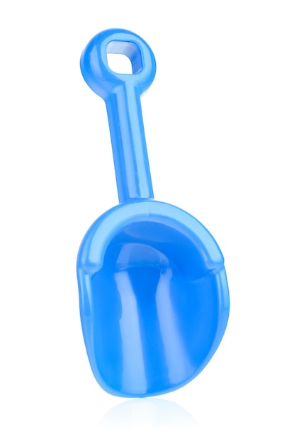 Blue plastic shovel isolated on a white background closeup Children's toys for playing in the sandbox Games for early child development Childhood concept