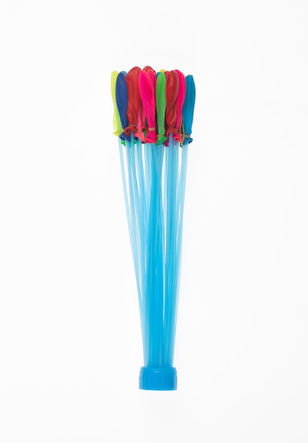 A blue plastic straw holder with a blue plastic straw that says'the best'on it.