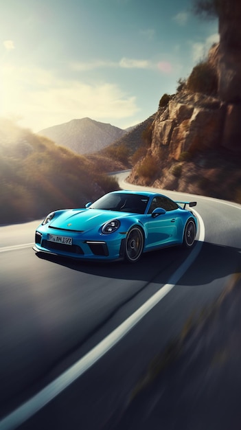 A blue porsche 997 gt3 sports car is driving on a mountain road.