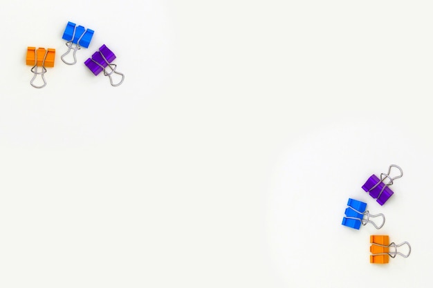 Blue and purple clips on a white background