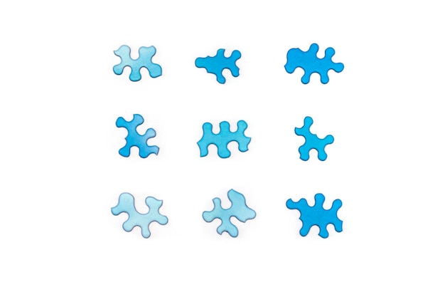 Blue puzzles on white background Difficult unusual task concept