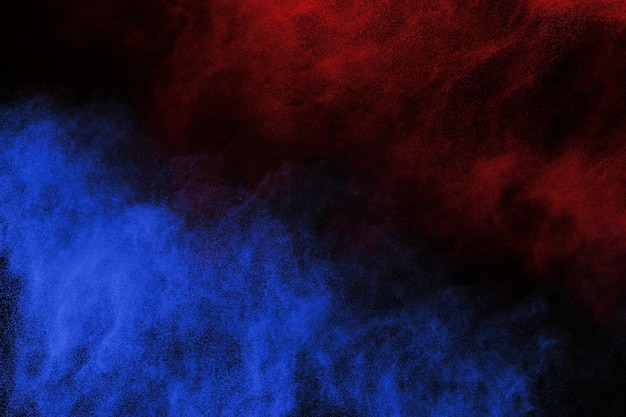 Blue and Red color powder explosion on black background