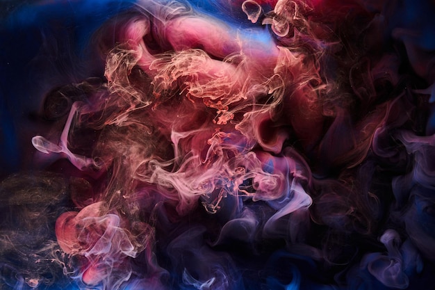 Blue red ink abstract background Acrylic paint backdrop for perfume hookah cosmetics Mysterious smoke clouds colorful fog