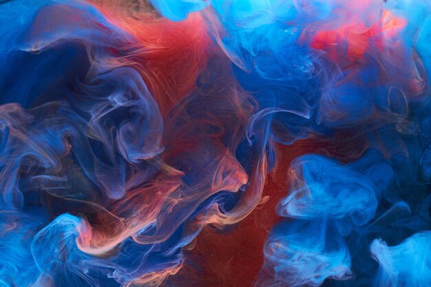 Blue red ink abstract background Acrylic paint backdrop for perfume hookah cosmetics Mysterious smoke clouds colorful fog