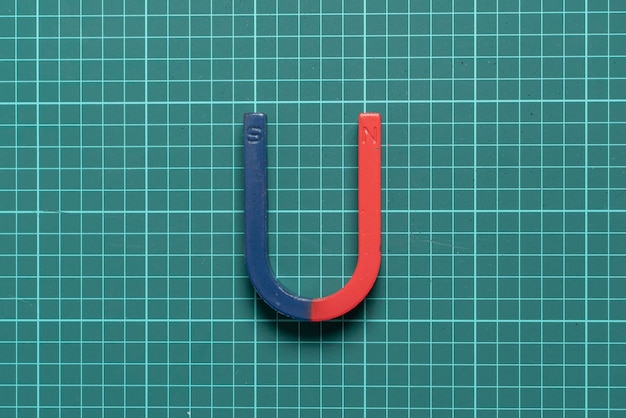 A blue and red magnet in form of horseshoe for studying purpose