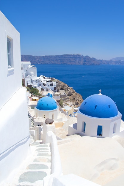 Blue roofs of churches on Santorini island in Greece